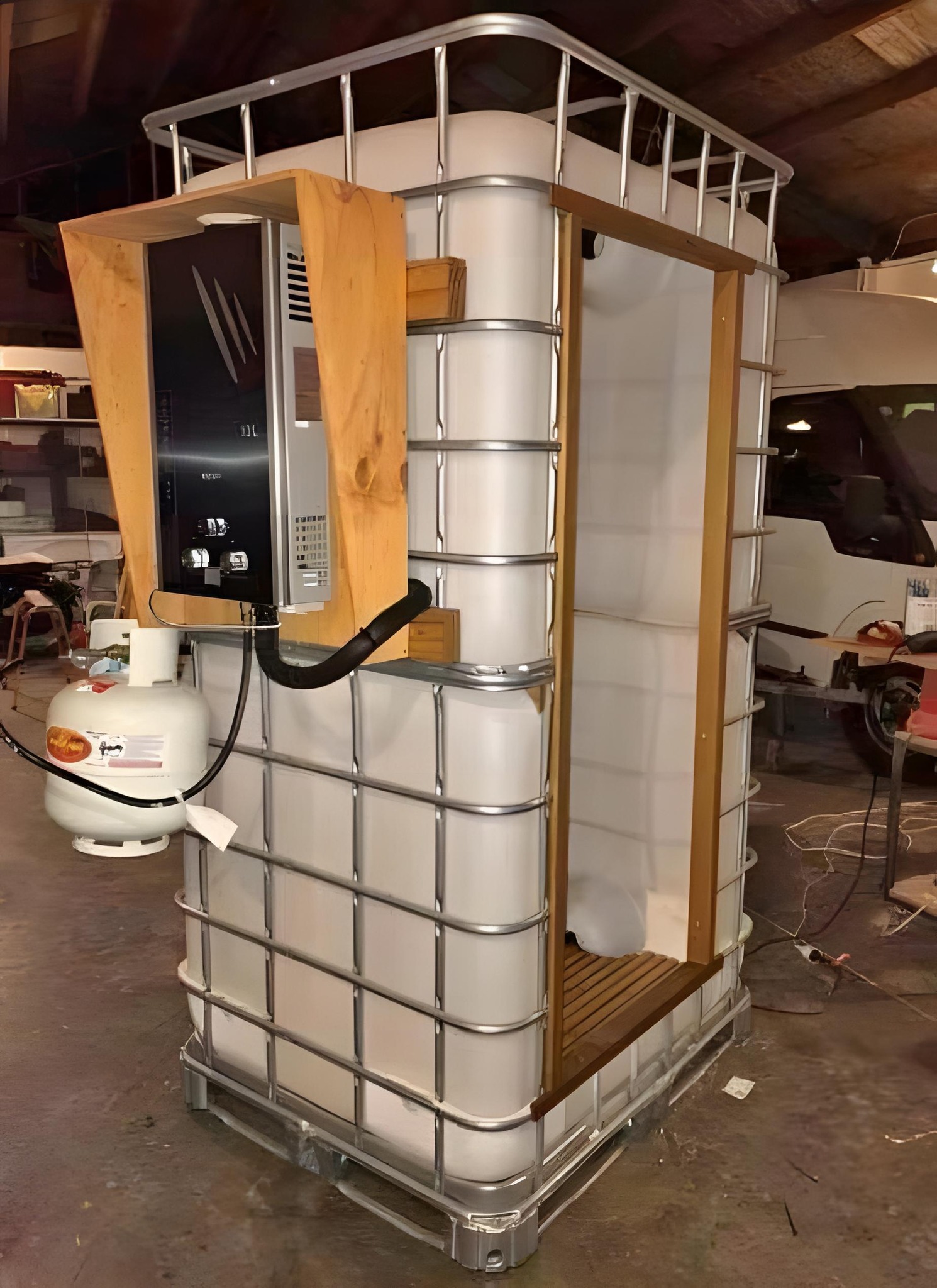 The meme is a photo of a toilet made from a large plastic storage container, with a toilet seat and a small shower area built into it. The text overlayed on the image reads "I'm not lazy, I'm just reusing resources". The meme is humorous because it takes a practical and environmentally-friendly approach to building a toilet, while also poking fun at the idea of being "lazy" when it's actually just a clever use of resources.